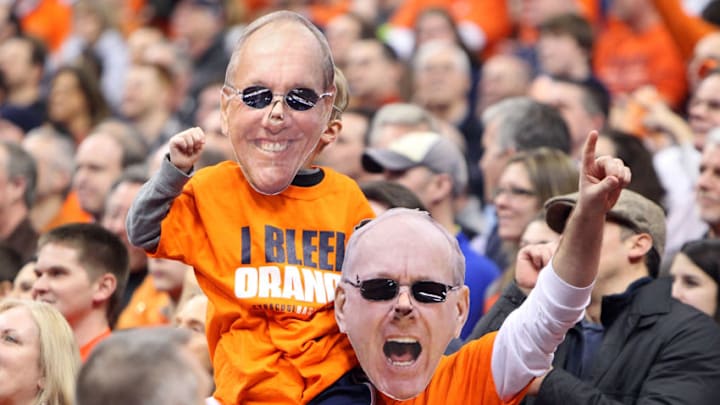 SYRACUSE, NY - JANUARY 21: Fans of the Syracuse Orange cheer with masks of head coach Jim Boeheim (not pictured) over their faces during the game against the Cincinnati Bearcats at the Carrier Dome on January 21, 2013 in Syracuse, New York. (Photo by Nate Shron/Getty Images)