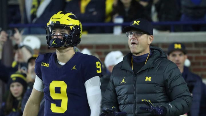 Michigan Wolverines quarterback J.J. McCarthy and coach Jim Harbaugh before action against the Purdue Boilermakers at Michigan Stadium, Saturday, Nov. 4, 2023.