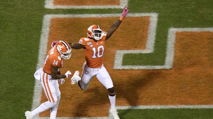 CLEMSON, SOUTH CAROLINA - OCTOBER 26: Wide receiver Joe Ngata #10 celebrates with wide receiver Diondre Overton #14 of the Clemson Tigers after Overton scores a touchdown against the Boston College Eagles during the first quarter of their football game at Memorial Stadium on October 26, 2019 in Clemson, South Carolina. (Photo by Mike Comer/Getty Images)