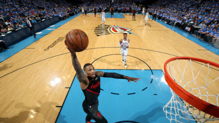 OKLAHOMA CITY, OK - APRIL 21: Damian Lillard #0 of the Portland Trail Blazers dunks the ball during the game against the Oklahoma City Thunder during Game Four of Round One of the 2019 NBA Playoffs on April 21, 2019 at Chesapeake Energy Arena in Oklahoma City, Oklahoma. NOTE TO USER: User expressly acknowledges and agrees that, by downloading and/or using this photograph, user is consenting to the terms and conditions of the Getty Images License Agreement. Mandatory Copyright Notice: Copyright 2019 NBAE (Photo by Zach Beeker/NBAE via Getty Images)