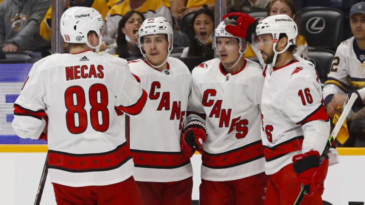 NASHVILLE, TENNESSEE - MAY 27: Martin Necas #88 and Vincent Trocheck #16 of the Carolina Hurricanes celebrate with teammates after a goal against the Nashville Predators during the second period in Game Six of the First Round of the 2021 Stanley Cup Playoffs at Bridgestone Arena on May 27, 2021 in Nashville, Tennessee. (Photo by Frederick Breedon/Getty Images)