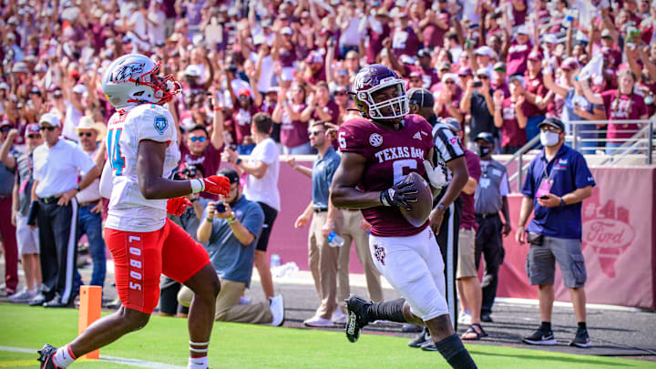 Sep 18, 2021; College Station, Texas, USA; Texas A&M Aggies running back Devon Achane (6) scores a touchdown during the game between the Texas A&M Aggies and the New Mexico Lobos at Kyle Field. Mandatory Credit: Jerome Miron-USA TODAY Sports