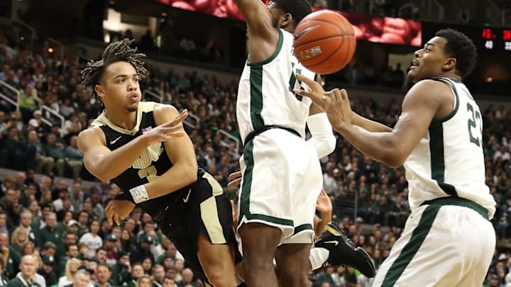 EAST LANSING, MICHIGAN – JANUARY 08: Carsen Edwards #3 of the Purdue Boilermakers passes around Aaron Henry #11 of the Michigan State Spartans during the second half at Breslin Center on January 08, 2019 in East Lansing, Michigan. Michigan State won the game 77-59. (Photo by Gregory Shamus/Getty Images)