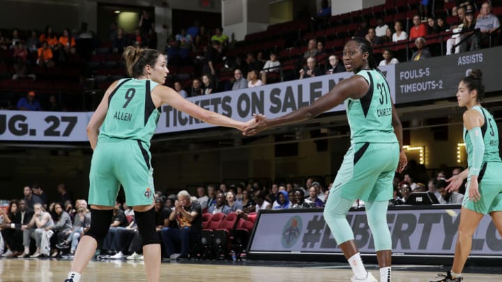 WHITE PLAINS, NY- AUGUST 13: Rebecca Allen #9 hi-fives Tina Charles #31 of the New York Liberty on August 13, 2019 at the Westchester County Center, in White Plains, New York. NOTE TO USER: User expressly acknowledges and agrees that, by downloading and or using this photograph, User is consenting to the terms and conditions of the Getty Images License Agreement. Mandatory Copyright Notice: Copyright 2019 NBAE (Photo by Steven Freeman/NBAE via Getty Images)