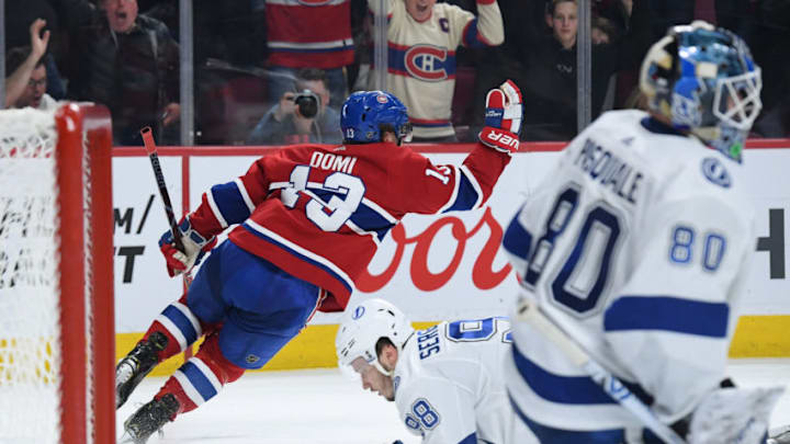MONTREAL, QC - APRIL 2: Max Domi #13 of the Montreal Canadiens celebrate after scoring a goal o goaltender Edward Pasquale #80 of the Tampa Bay Lightning in the NHL game at the Bell Centre on April 2, 2019 in Montreal, Quebec, Canada. (Photo by Francois Lacasse/NHLI via Getty Images)