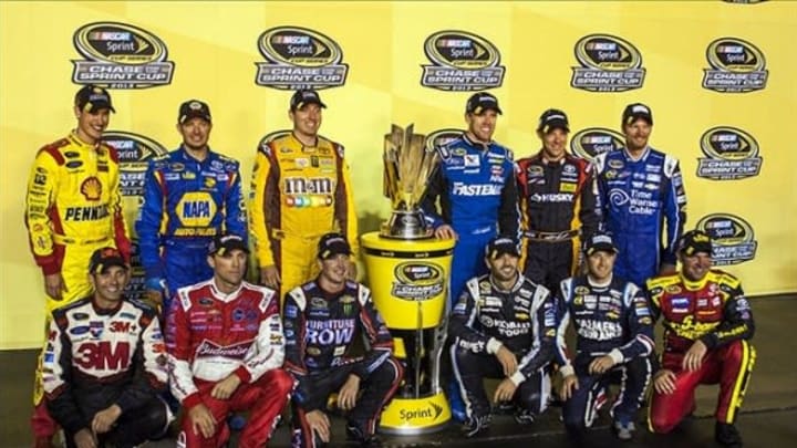 Sep 7, 2013; Richmond, VA, USA; The NASCAR Chase for the Sprint Cup field poses for a photo with the trophy after the Federated Auto Parts 400 at Richmond International Raceway. Mandatory Credit: Peter Casey-USA TODAY Sports