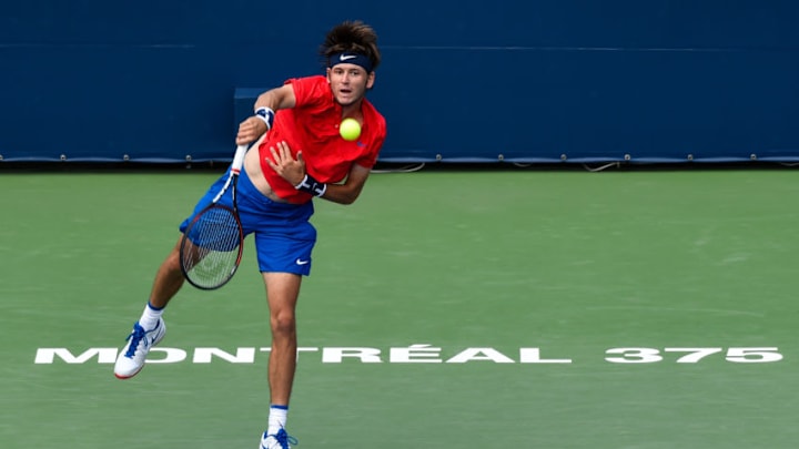 MONTREAL, QC - AUGUST 07: Jared Donaldson of the United States serves against Lucas Pouille of France during day four of the Rogers Cup presented by National Bank at Uniprix Stadium on August 7, 2017 in Montreal, Quebec, Canada. (Photo by Minas Panagiotakis/Getty Images)
