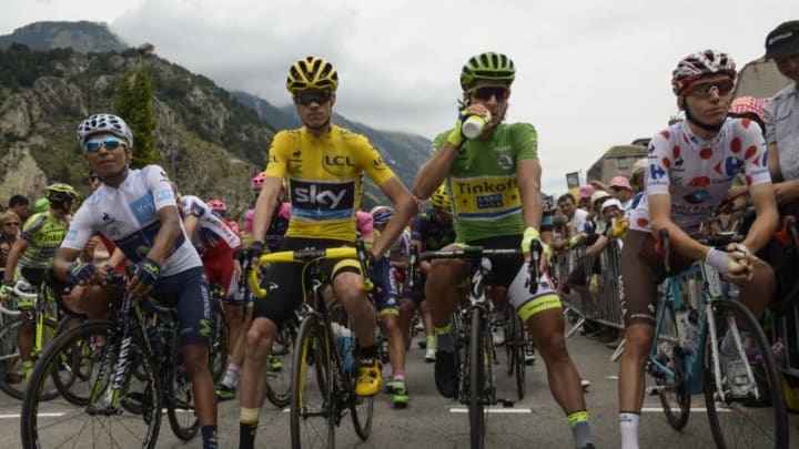 (From L) Colombia's Nairo Quintana, wearing the best young's white jersey, Great Britain's Christopher Froome, wearing the overall leader's yellow jersey, Slovakia's Peter Sagan, wearing the best sprinter's green jersey and France's Romain Bardet, wearing the best climber's polka dot jersey wait for the start of the 110,5 km twentieth stage of the 102nd edition of the Tour de France cycling race on July 25, 2015, between Modane Valfrejus and Alpe d'Huez, French Alps. AFP PHOTO / LIONEL BONAVENTURE (Photo credit should read LIONEL BONAVENTURE/AFP/Getty Images)