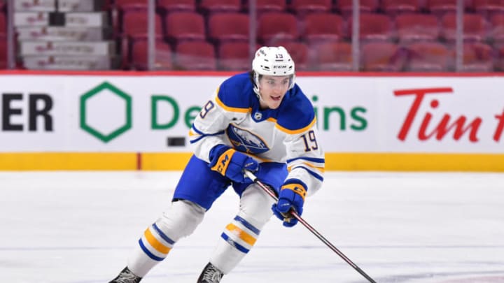 MONTREAL, QC - FEBRUARY 13: Peyton Krebs #19 of the Buffalo Sabres skates the puck against the Montreal Canadiens during the first period at Centre Bell on February 13, 2022 in Montreal, Canada. The Buffalo Sabres defeated the Montreal Canadiens 5-3. (Photo by Minas Panagiotakis/Getty Images)