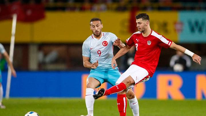 VIENNA, AUSTRIA - MARCH 29: Cenk Tosun of Turkey (L) competes for the ball with Aleksandar Dragovic of Austria during the international friendly match between Austria and Turkey at Ernst-Happel-Stadium on March 29, 2016 in Vienna, Austria. (Photo by Christian Hofer/Getty Images)