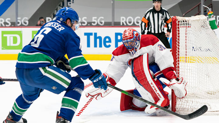 VANCOUVER, BC – MARCH 08: Goalie Carey Price #31 of the Montreal Canadiens stops Brock Boeser #6 of the Vancouver Canucks in close during NHL hockey action at Rogers Arena on March 8, 2021 in Vancouver, Canada. (Photo by Rich Lam/Getty Images)