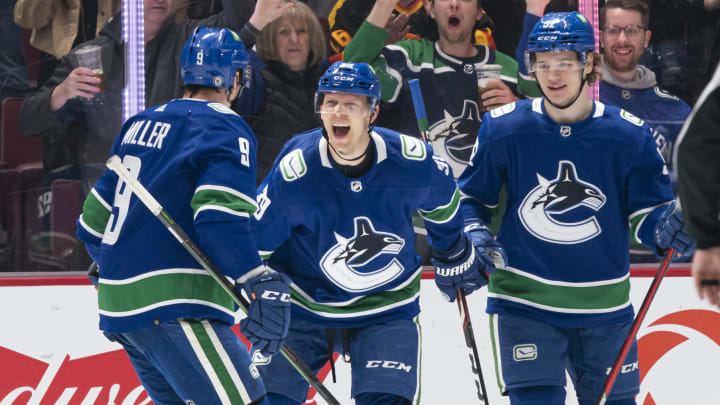 VANCOUVER, BC – APRIL 14: Alex Chiasson #39 of the Vancouver Canucks celebrates with teammates J.T. Miller #9 and Vasily Podkolzin #92 after scoring a goal against the Phoenix Coyotes during the first period at Rogers Arena on April 14, 2022in Vancouver, British Columbia, Canada. (Photo by Rich Lam/Getty Images)