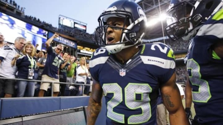 Aug 22, 2014; Seattle, WA, USA; Seattle Seahawks free safety Earl Thomas (29) celebrates after a 59-yard punt return against the Chicago Bears during the second quarter at CenturyLink Field. Seattle Seahawks strong safety Jeron Johnson (23) is at right. Mandatory Credit: Joe Nicholson-USA TODAY Sports
