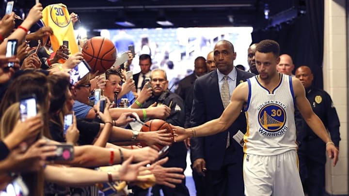 Feb 25, 2016; Orlando, FL, USA; Golden State Warriors guard Stephen Curry (30) greets fans in the tunnel after a basketball game against the Orlando Magic at Amway Center. The Warriors won 130-114. Mandatory Credit: Reinhold Matay-USA TODAY Sports