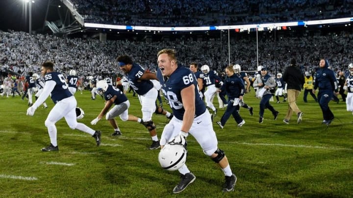 Oct 22, 2016; University Park, PA, USA; Penn State Nittany Lions guard Hunter Kelly (68) runs on the field with teammates and coaches following the game against the Ohio State Buckeyes at Beaver Stadium. Penn State defeated Ohio State 24-21. Mandatory Credit: Rich Barnes-USA TODAY Sports
