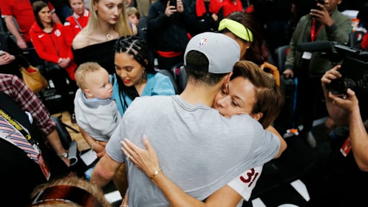 Warriors guard Steph Curry hugs his mom (Photo by Jonathan Ferrey/Getty Images)