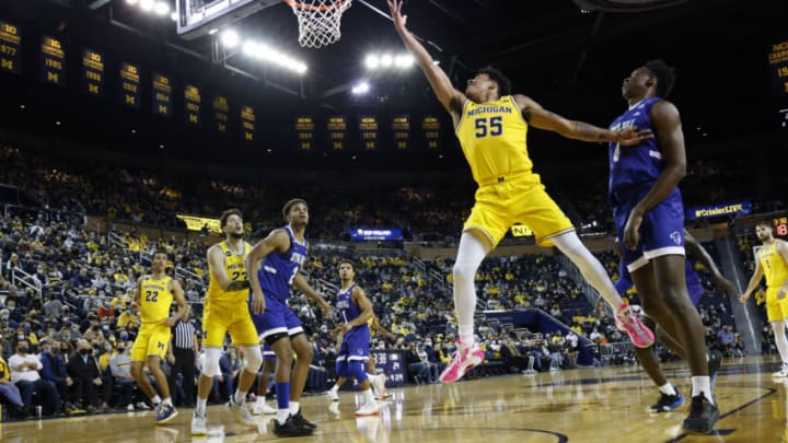 Nov 16, 2021; Ann Arbor, Michigan, USA; Michigan Wolverines guard Eli Brooks (55) goes to the basket on Seton Hall Pirates forward Tyrese Samuel (4) in the first half at Crisler Center. Mandatory Credit: Rick Osentoski-USA TODAY Sports