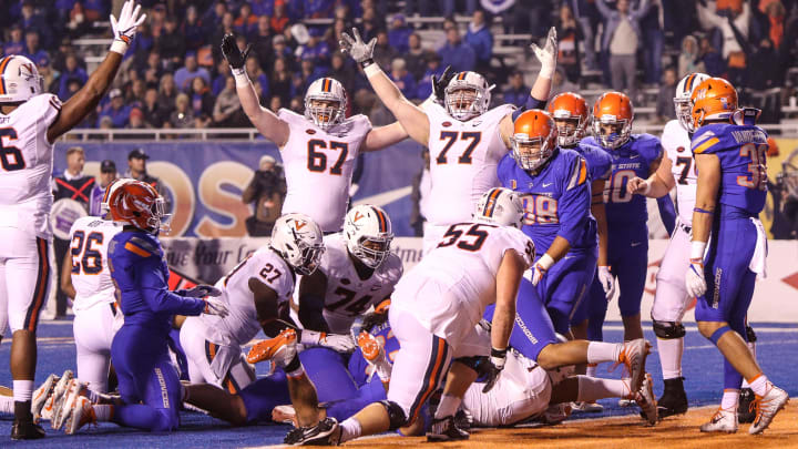 BOISE, ID – SEPTEMBER 22: The Virginia Cavaliers celebrate a touchdown during second half action against the Boise State Broncos on September 22, 2017 at Albertsons Stadium in Boise, Idaho. Virginia won the game 42-23. (Photo by Loren Orr/Getty Images)