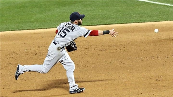 Jul 16, 2013; Flushing, NY, USA; American League infielder Dustin Pedroia (15) of the Boston Red Sox tosses the ball to first base in the 2013 All Star Game at Citi Field. Mandatory Credit: Anthony Gruppuso-USA TODAY Sports