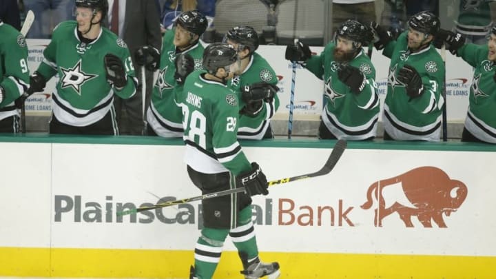 Mar 17, 2016; Dallas, TX, USA; Dallas Stars defenseman Stephen Johns (28) is congratulated by his teammates after scoring his first career goal in the third period against the Tampa Bay Lightning at American Airlines Center. The Stars won 4-3. Mandatory Credit: Tim Heitman-USA TODAY Sports