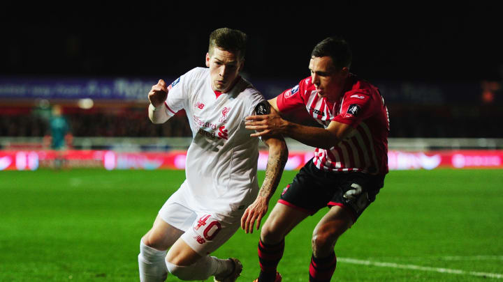 EXETER, ENGLAND – JANUARY 08: Ryan Kent of Liverpool takes on Jordan Tillson of Exeter City during the Emirates FA Cup third round match between Exeter City and Liverpool at St James Park on January 8, 2016 in Exeter, England. (Photo by Dan Mullan/Getty Images)