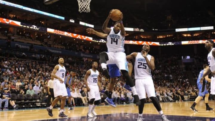 Dec 27, 2014; Charlotte, NC, USA; Charlotte Hornets forward Michael Kidd-Gilchrist (14) gets a rebound during the second half of the game against the Orlando Magic at Time Warner Cable Arena. Orlando wins 102-94. Mandatory Credit: Sam Sharpe-USA TODAY Sports