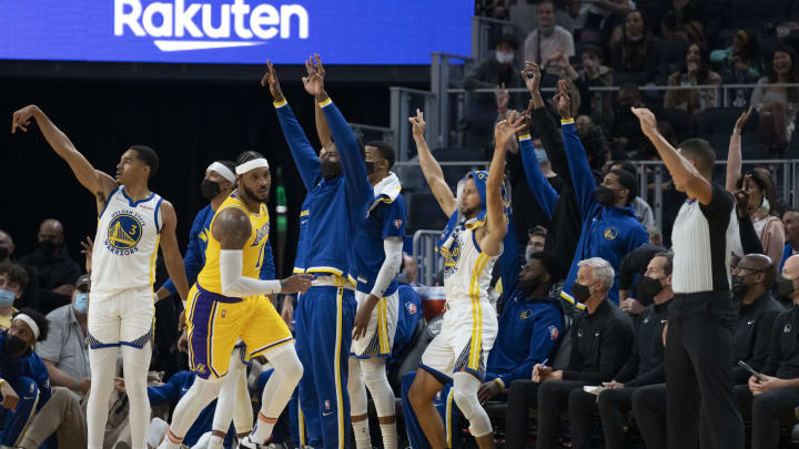 October 8, 2021; San Francisco, California, USA; Golden State Warriors guard Stephen Curry (30) celebrates a three-point basket by guard Jordan Poole (3) against the Los Angeles Lakers during the second quarter at Chase Center. Mandatory Credit: Kyle Terada-USA TODAY Sports