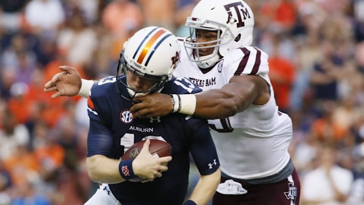 Sep 17, 2016; Auburn, AL, USA; Texas A&M Aggies lineman Myles Garrett (15) tackles Auburn Tigers quarterback Sean White (13) during the first quarter at Jordan Hare Stadium. Mandatory Credit: John Reed-USA TODAY Sports