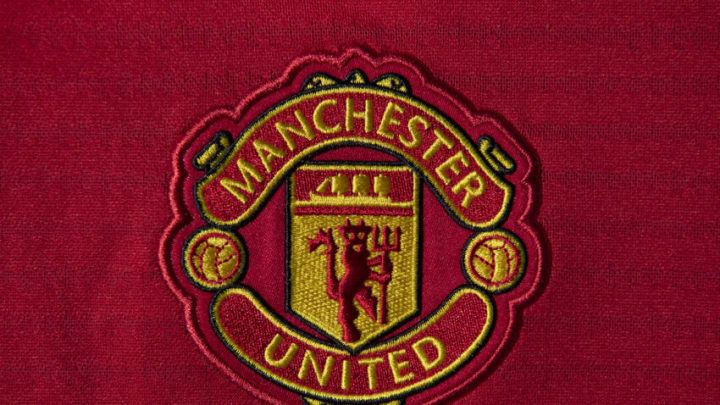 MANCHESTER, ENGLAND - APRIL 24: The Manchester United club crest on a first team home shirt on April 24, 2020 in Manchester, England (Photo by Visionhaus)