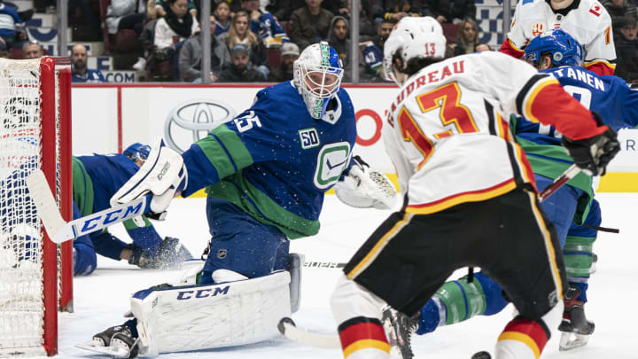 Jacob Markstrom of the Vancouver Canucks stops Johnny Gaudreau of the Calgary Flames (By Rich Lam/Getty Images)