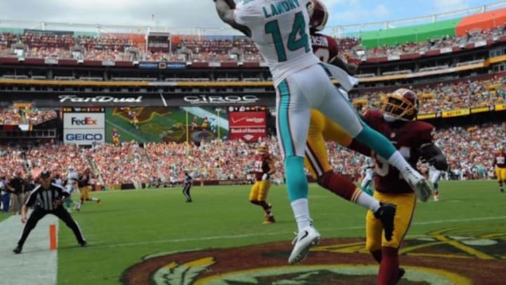 Sep 13, 2015; Landover, MD, USA; Washington Redskins cornerback David Amerson (39) breaks up a pass intended for Miami Dolphins wide receiver Jarvis Landry (14) during the first half at FedEx Field. Mandatory Credit: Brad Mills-USA TODAY Sports