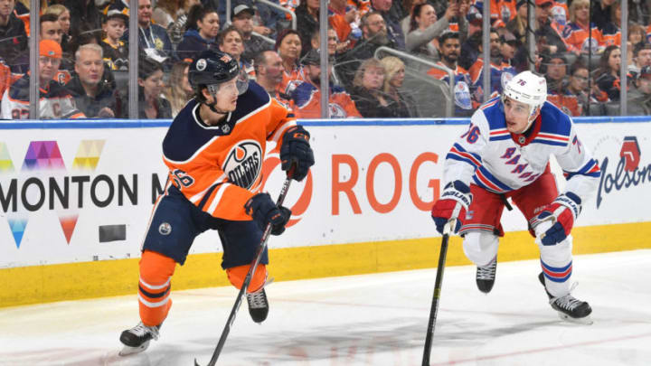 EDMONTON, AB - DECEMBER 31: Kailer Yamamoto #56 of the Edmonton Oilers skates with the puck while being pursued by Brady Skjei #76 of the New York Rangers on December 31, 2019, at Rogers Place in Edmonton, Alberta, Canada. (Photo by Andy Devlin/NHLI via Getty Images)