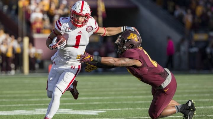 Oct 17, 2015; Minneapolis, MN, USA; Nebraska Cornhuskers wide receiver Jordan Westerkamp (1) rushes with the ball after making a catch for a first down as Minnesota Golden Gophers defensive back Antonio Johnson (11) attempts to make a tackle in the second half at TCF Bank Stadium. The Cornhuskers won 48-25. Mandatory Credit: Jesse Johnson-USA TODAY Sports