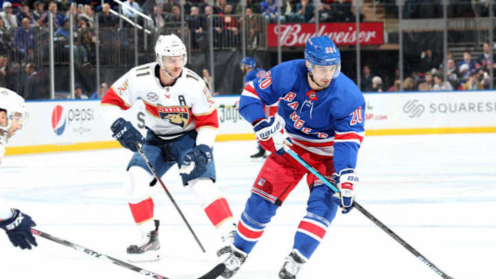 NEW YORK, NY - NOVEMBER 17: Chris Kreider #20 of the New York Rangers skates with the puck against Jonathan Huberdeau #11 of the Florida Panthers at Madison Square Garden on November 17, 2018 in New York City. The New York Rangers won 4-2. (Photo by Jared Silber/NHLI via Getty Images)