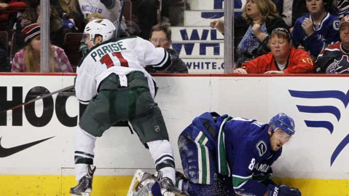 Zach Parise #11 of the Minnesota Wild and Chris Tanev #8 of the Vancouver Canucks (Photo by Ben Nelms/Getty Images)