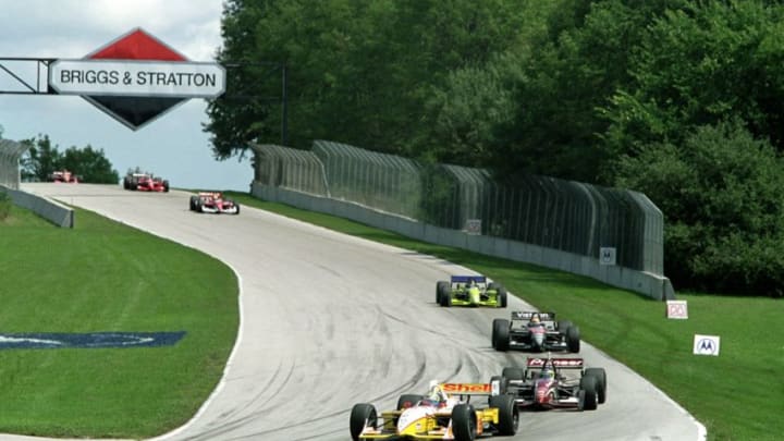 20 Aug 2000: Kenny Brack of Sweden who drives a Ford Reynard 2KI for Team Rahal leads the pack out of a turn during the Motorola 220, part of the 2000 CART FedEx Championship Series at Road America in Elkhart Lake, Wisconsin.Mandatory Credit: Jon Ferrey /Allsport