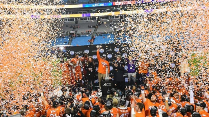 Clemson Head Coach Dabo Swinney raises the ACC football championship trophy after the Tigers beat Virginia Cavaliers 62-17 in Charlotte, N.C., Saturday, Dec. 7, 2019.2019 Acc Football Championship Clemson Vs Virginia