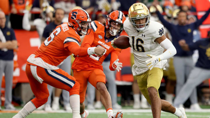 SYRACUSE, NEW YORK – OCTOBER 29: Garrett Shrader #6 of the Syracuse Orange attempts to get a hand on Brandon Joseph #16 of the Notre Dame Fighting Irish during the first quarter at JMA Wireless Dome on October 29, 2022 in Syracuse, New York. (Photo by Bryan M. Bennett/Getty Images)