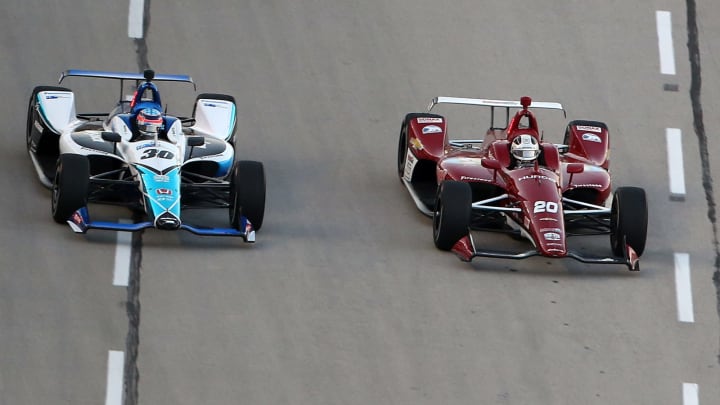 FORT WORTH, TEXAS – JUNE 08: Ed Carpenter of the United States, driver of the #20 Ed Carpenter Racing Chevrolet, battles Takuma Sato of Japan, driver of the #30 ABeam Consulting Honda (Photo by Brian Lawdermilk/Getty Images)