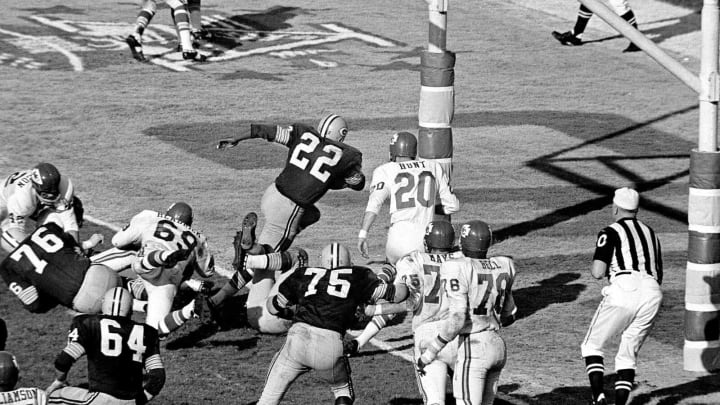 Green Bay’s Elijah Pitts (22) charges into the end zone, eluding Bobby Hunt (20), during the first Super Bowl in Los Angeles, Jan. 16, 1967. Pitts scored from the five on the play following Willie Wood’s interception in the third quarter. Packers beat the Chiefs, 35-10.