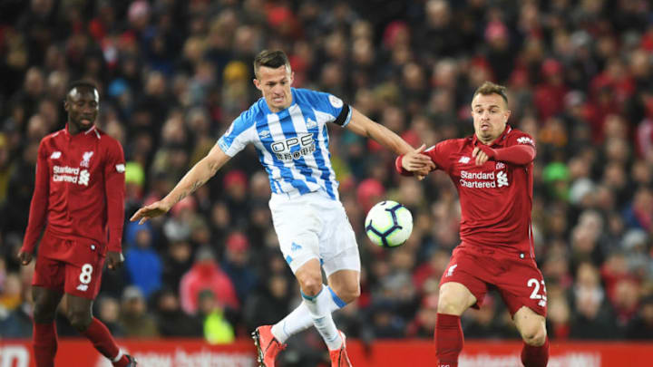 LIVERPOOL, ENGLAND - APRIL 26: Jonathan Hogg of Huddersfield Town battles with Xherdan Shaqiri of Liverpool during the Premier League match between Liverpool FC and Huddersfield Town at Anfield on April 26, 2019 in Liverpool, United Kingdom. (Photo by Michael Regan/Getty Images)