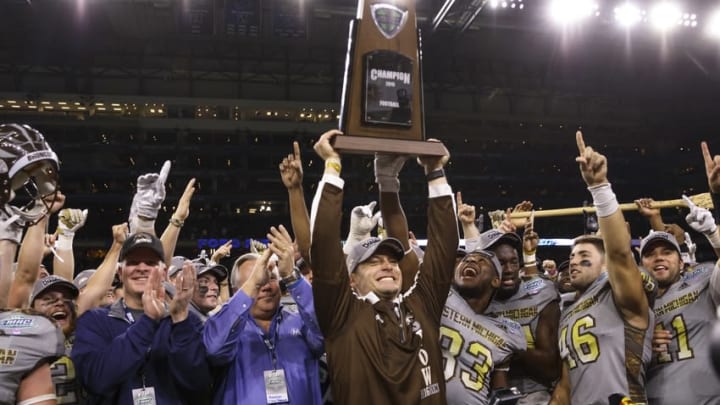 Dec 2, 2016; Detroit, MI, USA; Western Michigan Broncos head coach P. J. Fleck holds up the championship trophy after defeating the Ohio Bobcats for the Mac Championship 29-23 at Ford Field. Mandatory Credit: Rick Osentoski-USA TODAY Sports