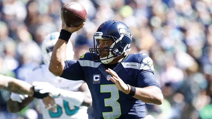 Sep 11, 2016; Seattle, WA, USA; Seattle Seahawks quarterback Russell Wilson (3) pump fakes on a scramble against the Miami Dolphins during the first quarter at CenturyLink Field. Mandatory Credit: Joe Nicholson-USA TODAY Sports