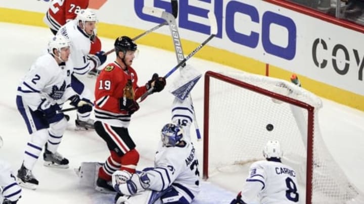 Oct 22, 2016; Chicago, IL, USA; Toronto Maple Leafs goalie Frederik Andersen (31) blocks a shot as Chicago Blackhawks center Jonathan Toews (19) and Toronto Maple Leafs defenseman Matt Hunwick (2) look on in the second period at the United Center. Mandatory Credit: Matt Marton-USA TODAY Sports