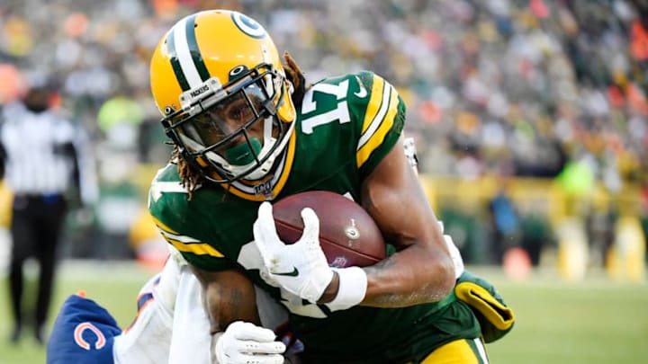 GREEN BAY, WISCONSIN - DECEMBER 15: Davante Adams #17 of the Green Bay Packers gets a first down in the second half against Eddie Jackson #39 of the Chicago Bears at Lambeau Field on December 15, 2019 in Green Bay, Wisconsin. (Photo by Quinn Harris/Getty Images)