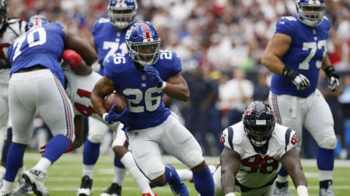 HOUSTON, TX - SEPTEMBER 23: Saquon Barkley #26 of the New York Giants rushes the ball against the Houston Texans at NRG Stadium on September 23, 2018 in Houston, Texas. (Photo by Tim Warner/Getty Images)