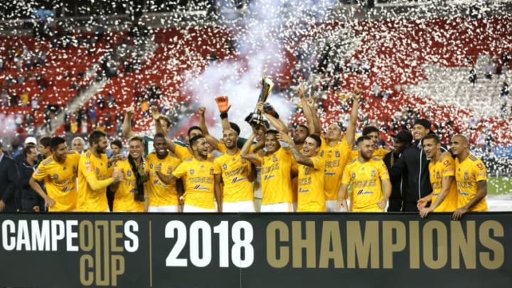 Tigres UANL team celebrates a 3-1 win against Toronto FC and hold the Campeones Cup at BMO Field in Toronto, Ontario, September 19, 2018. (Photo by Lars Hagberg / AFP) (Photo credit should read LARS HAGBERG/AFP/Getty Images)