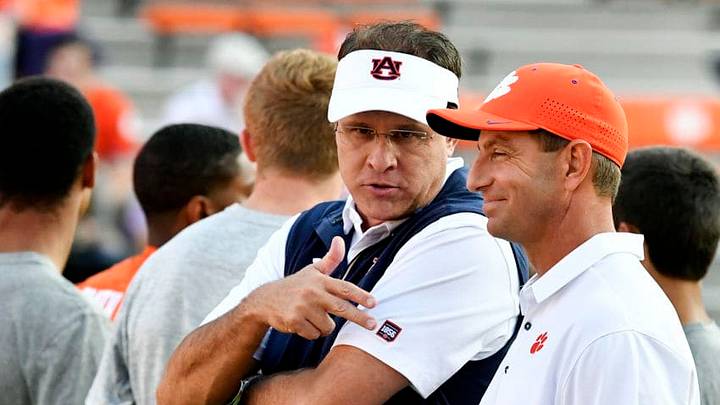 CLEMSON, SC - SEPTEMBER 09: Head coach Dabo Swinney of the Clemson Tigers and head coach Gus Malzahn of the Auburn Tigers talk before the start of the football game at Memorial Stadium on September 9, 2017 in Clemson, South Carolina. (Photo by Mike Comer/Getty Images) CLEMSON, SC - SEPTEMBER 09: Head coach Dabo Swinney of the Clemson Tigers and head coach Gus Malzahn of the Auburn Tigers talk before the start of the football game at Memorial Stadium on September 9, 2017 in Clemson, South Carolina. (Photo by Mike Comer/Getty Images)