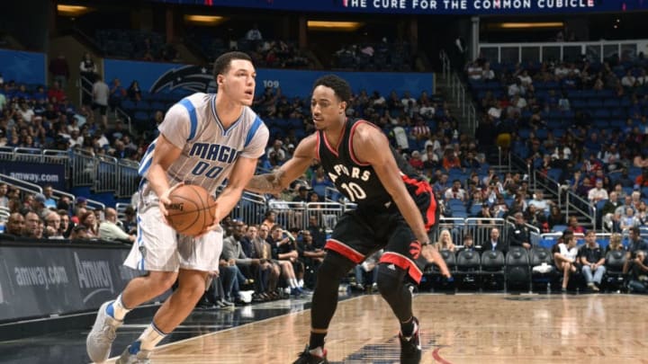 ORLANDO, FL - DECEMBER 18: Aaron Gordon #00 of the Orlando Magic handles the ball during the game against the Toronto Raptors on December 18, 2016 at Amway Center in Orlando, Florida. NOTE TO USER: User expressly acknowledges and agrees that, by downloading and or using this photograph, User is consenting to the terms and conditions of the Getty Images License Agreement. Mandatory Copyright Notice: Copyright 2016 NBAE (Photo by Gary Bassing/NBAE via Getty Images)
