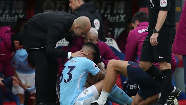 LONDON, ENGLAND - DECEMBER 31: Pep Guardiola the head coach / manager of Manchester City consoles an injured Gabriel Jesus of Manchester City during the Premier League match between Crystal Palace and Manchester City at Selhurst Park on December 31, 2017 in London, England. (Photo by Catherine Ivill/Getty Images)